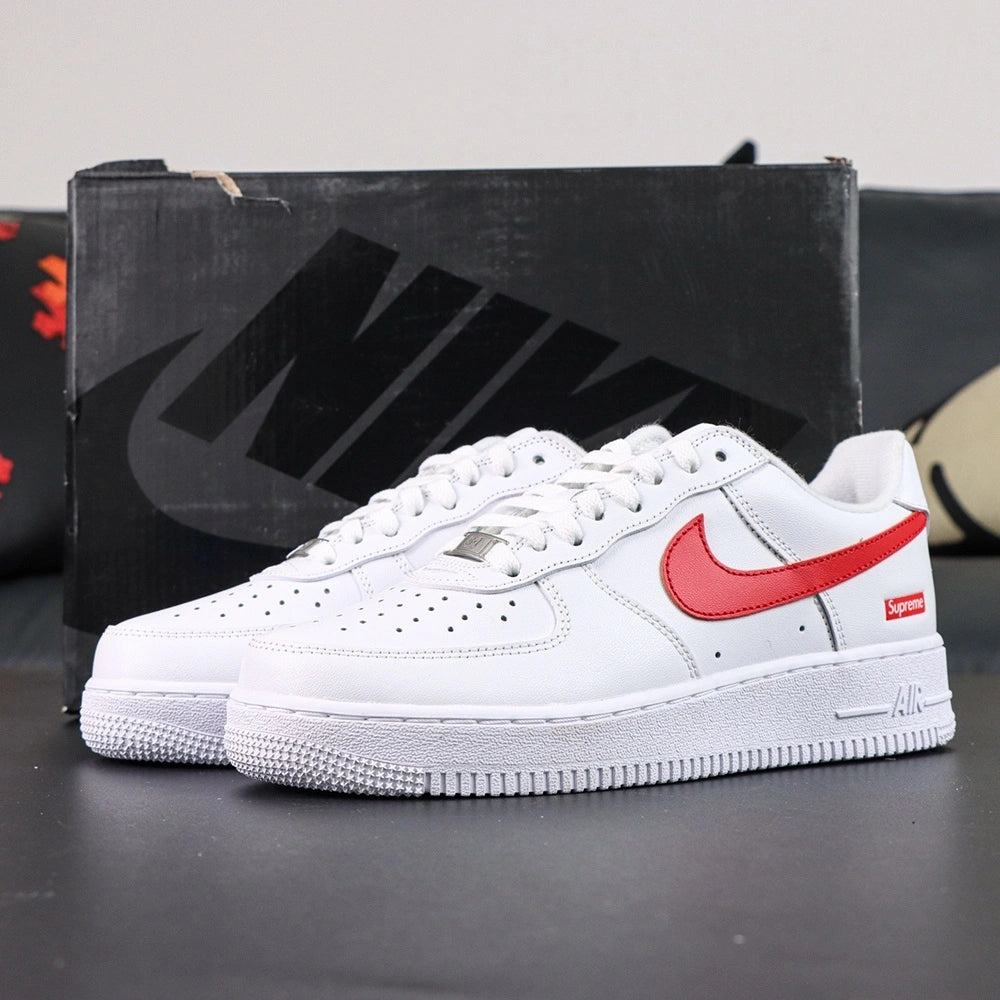 Supreme x Air Force 1 Low Box Logo Speed Red - pair overhead flat lay black background red Swoosh Supreme badge