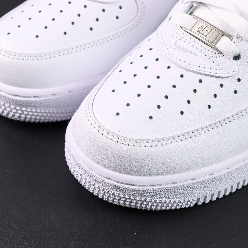 Supreme x Air Force 1 Low Box Logo White Black - pair three quarter view with black Nike box Pikachu