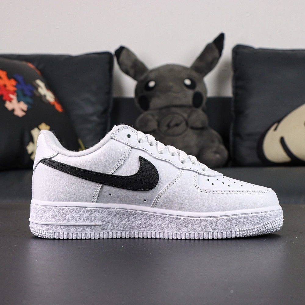 Supreme x Air Force 1 Low Box Logo White Black - pair three quarter view AIR midsole black Swoosh Supreme badge Pikachu