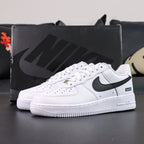 Supreme x Air Force 1 Low Box Logo White Black - pair overhead flat lay black background black Swoosh Supreme badge