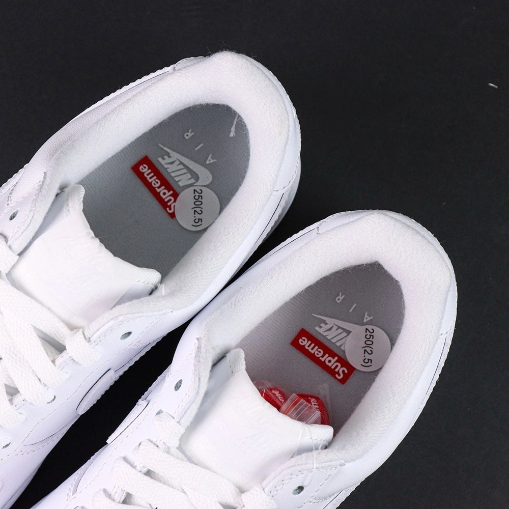 Supreme x Air Force 1 Low Box Logo White - single shoe lateral profile tonal white Swoosh red Supreme badge Pikachu