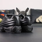 Supreme x Air Max 95 Lux Black - Full Lateral Profile View on White Background Showing Premium Black Leather AM95 Spine Overlay Construction Debossed Supreme Script on Quarter Panel and Dark-Tinted AM95 Air Units