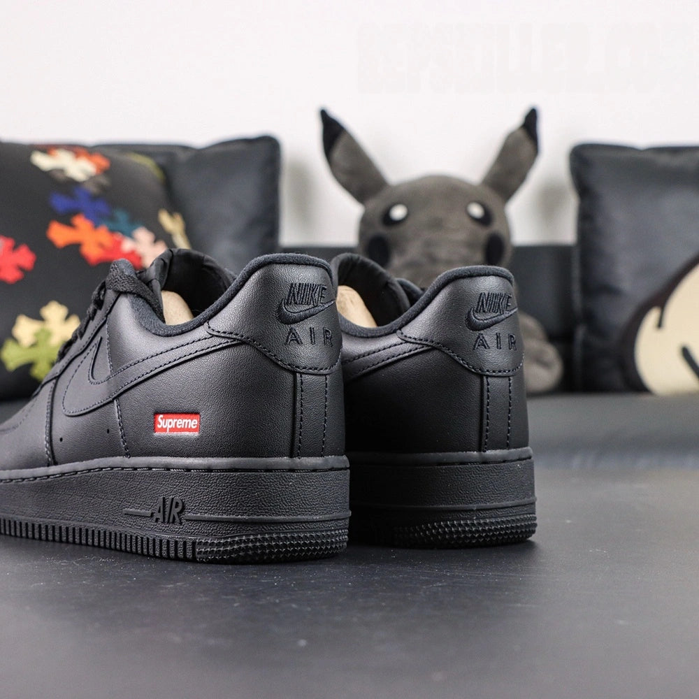 Supreme x Air Force 1 Low Box Logo Black - pair three quarter view red Supreme box logo Pikachu