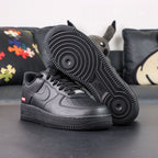 Supreme x Air Force 1 Low Box Logo Black - pair three quarter view outsole detail Pikachu lifestyle