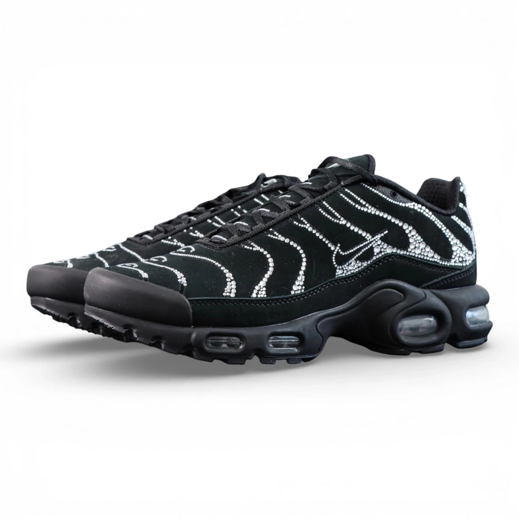 Swarovski x Air Max Plus Moonlight 2024 - Full Lateral Profile View with Black Shoebox on Dark Background Showing Triple Black TN Upper with Full Swarovski Crystal Rhinestone Dot-Matrix Coverage Tracing Wave-Form Divider Lines and Crystal Swoosh