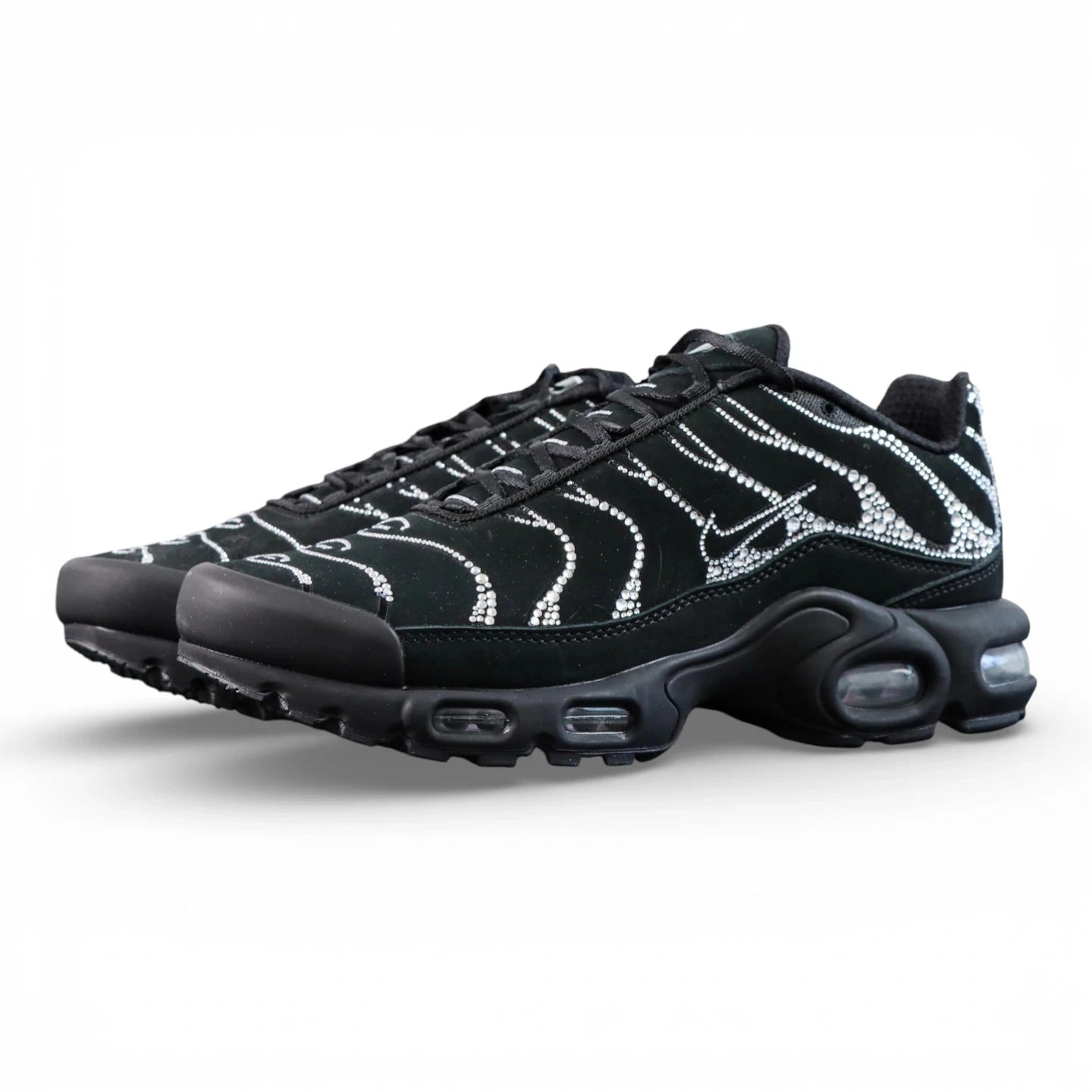 Swarovski x Air Max Plus Moonlight 2024 - Full Lateral Profile View with Black Shoebox on Dark Background Showing Triple Black TN Upper with Full Swarovski Crystal Rhinestone Dot-Matrix Coverage Tracing Wave-Form Divider Lines and Crystal Swoosh
