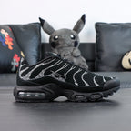 Swarovski x Air Max Plus Moonlight 2024 - Rear Heel View of Both Shoes with Pikachu Plush on Dark Background Showing Swarovski Crystal Rhinestone Coverage on Heel Counter Wave-Form Lines and Yellow Tn AIR Badge on Heel Tab