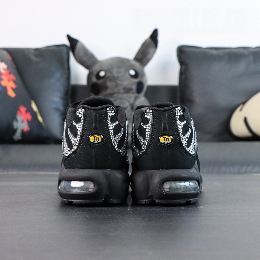 Swarovski x Air Max Plus Moonlight 2024 - Lateral Profile and Outsole View with Pikachu Plush on Dark Background Showing Full Crystal Rhinestone TN Upper and Full Black AM Plus Square-Block Circular Traction Outsole