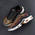Swarovski x Air Max Plus Sunset - Rear Heel View of Both Shoes on Dark Background Showing Deep Crimson Swarovski Crystal Heel Counter Panels Yellow Tn AIR Badge on Heel Tab and White Midsole with Amber-Tinted TN Air Cushioning Unit