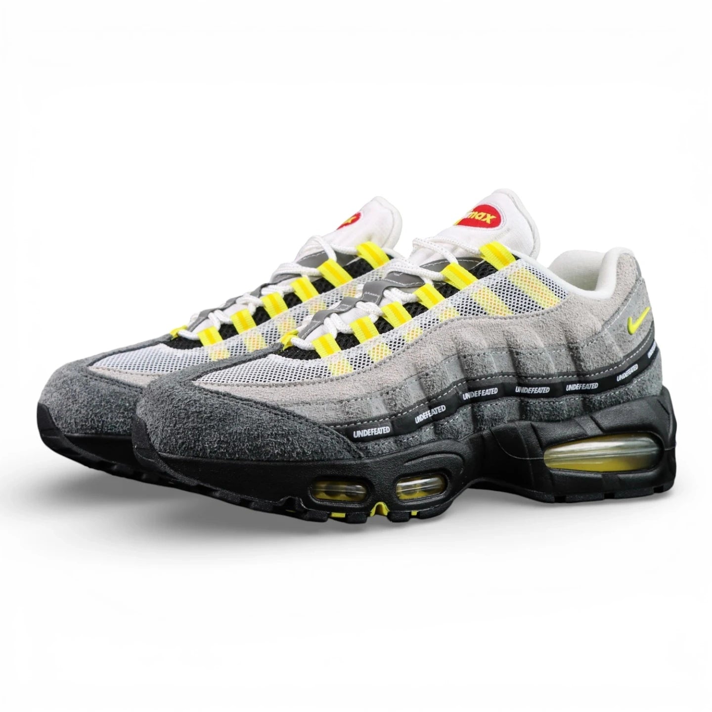 Undefeated x Air Max 95 Yellow 2025 — front three-quarter pair view