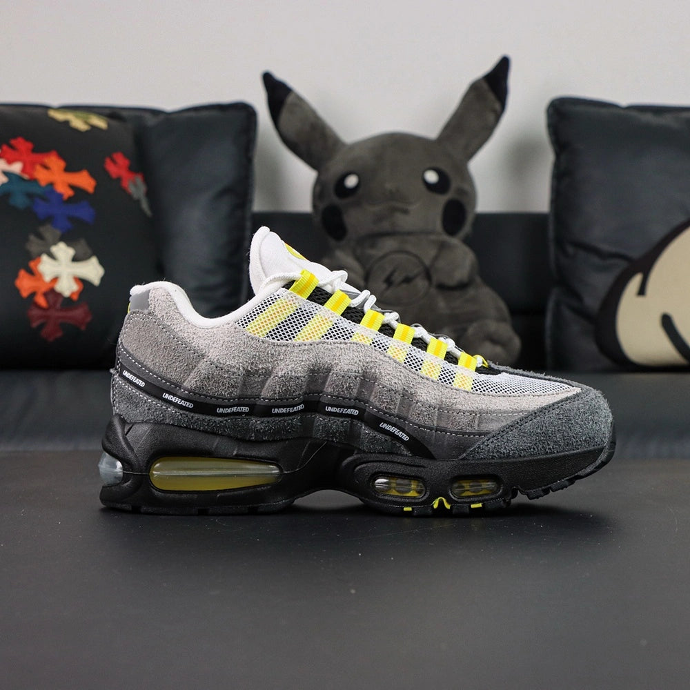 Undefeated x Air Max 95 Yellow 2025 — heel close-up pair