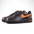 Vlone x NikeLab Air Force 1 Vlone - pair three quarter front view black leather orange Swoosh orange stitching Pikachu