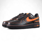Vlone x NikeLab Air Force 1 Vlone - pair three quarter front view black leather orange Swoosh orange stitching Pikachu