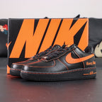 Vlone x NikeLab Air Force 1 Vlone - pair overhead flat lay black background orange Swoosh V embroidery