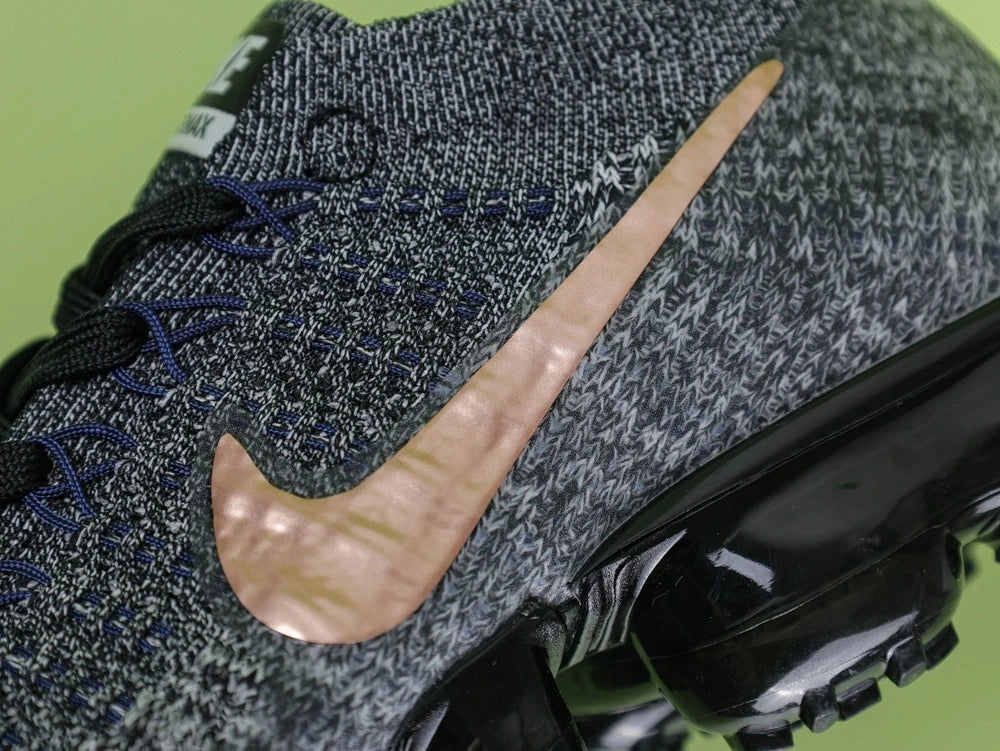 WMNS Air Vapormax Flyknit Explorer Dark — three-quarter pair lifestyle view
