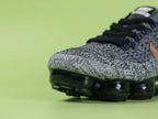 WMNS Air Vapormax Flyknit Explorer Dark — rose gold Swoosh lateral close-up