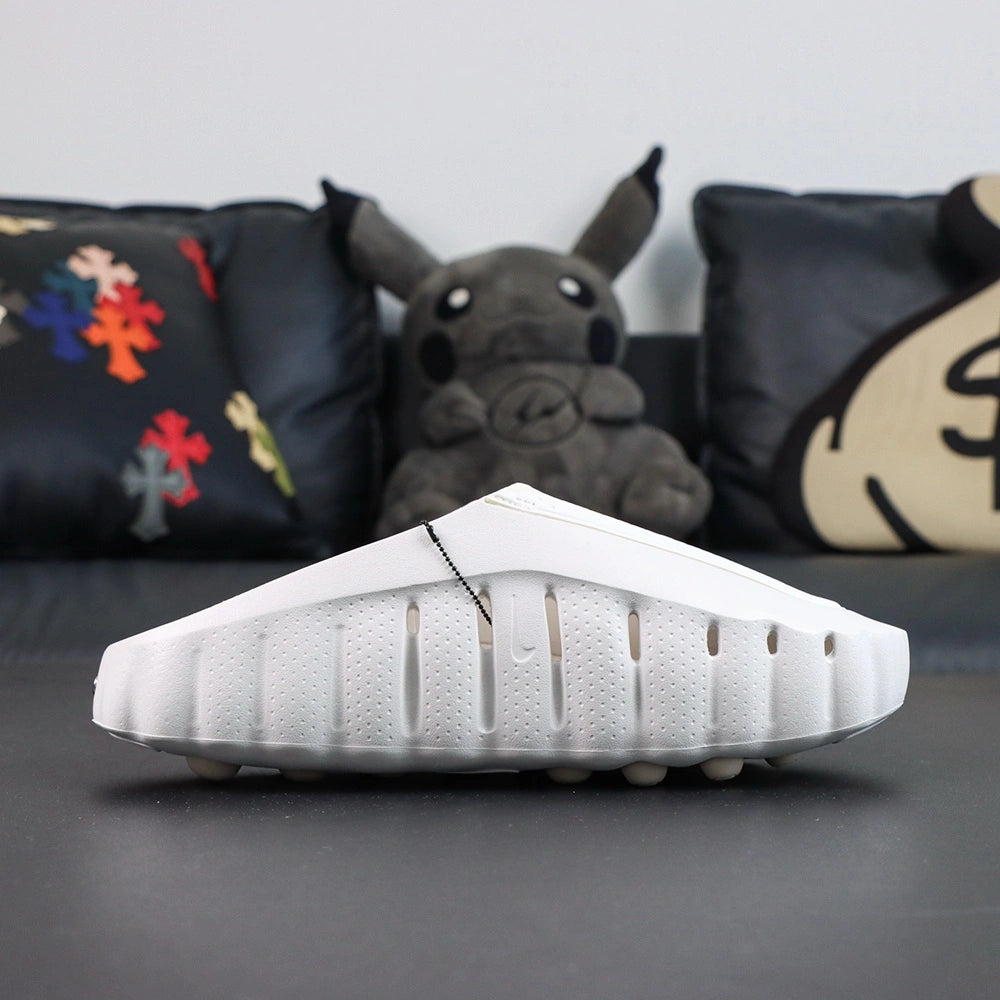 Wmns Mind 001 Mule Summit White 2026 - Side profile oversized silver Swoosh with Pikachu backdrop