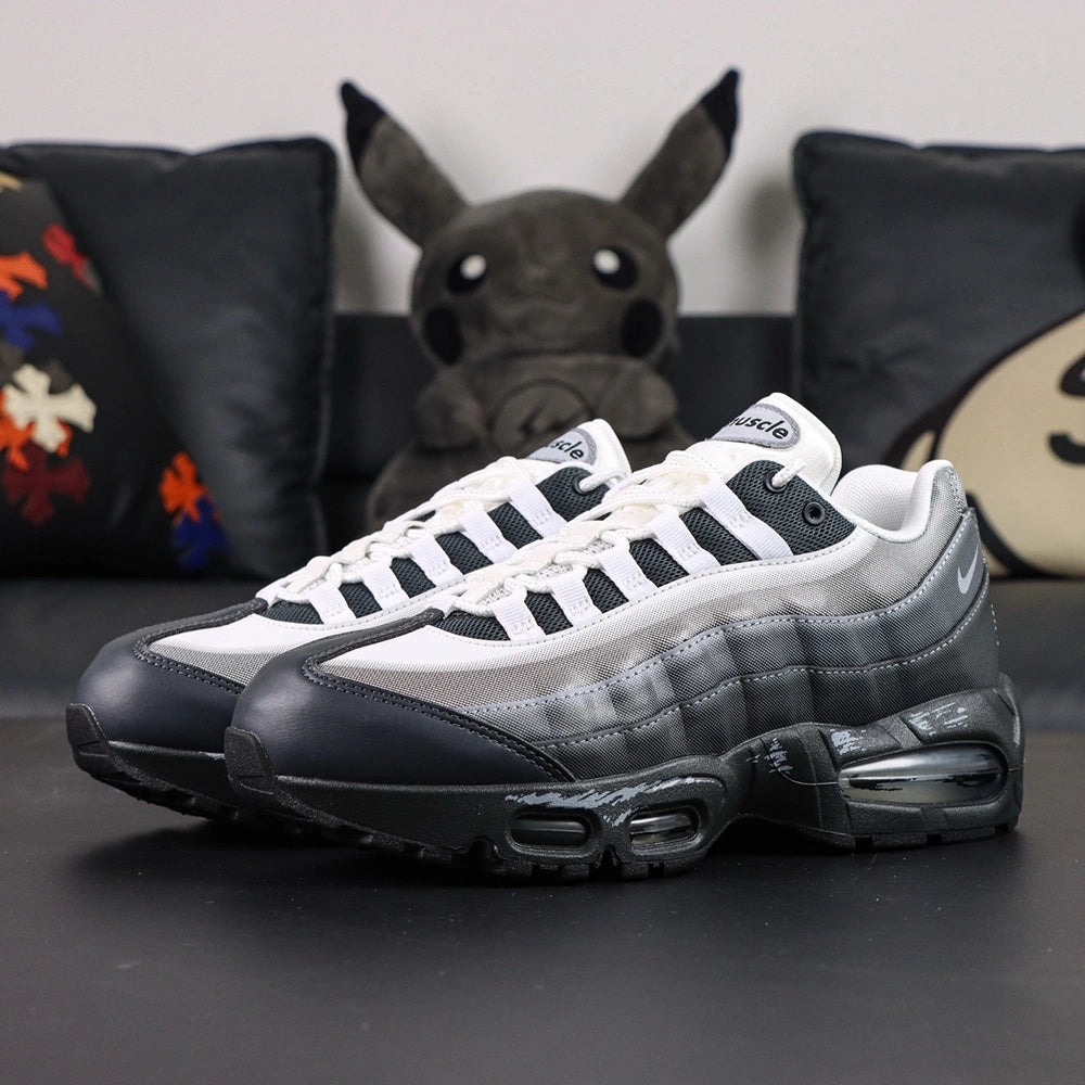 Yu-Gi-Oh x Air Max Muscle 95 QS Jonouchi 2025 — lateral pair with outsole Yu-Gi-Oh logo visible