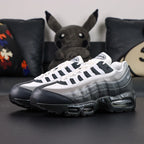 Yu-Gi-Oh x Air Max Muscle 95 QS Jonouchi 2025 — lateral pair with outsole Yu-Gi-Oh logo visible
