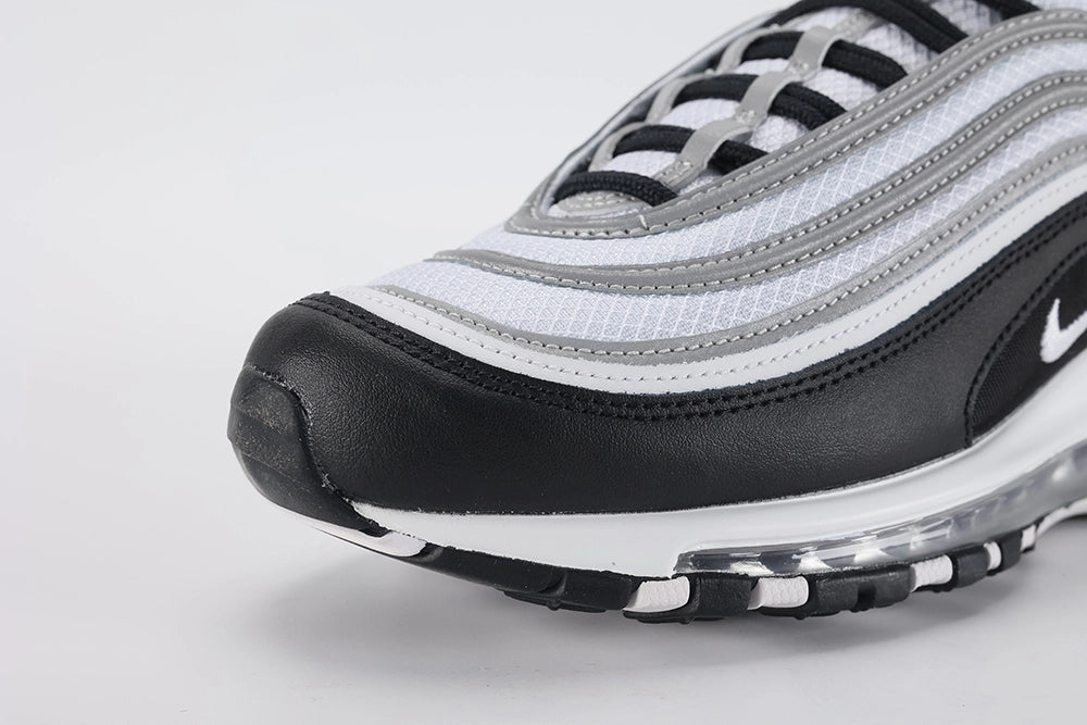 Air Max 97 Black Metallic Silver - Tongue and Lace Area Top Down View on White Background Showing White Tongue Black Air Max Text Woven Ribbon Pull Tab Black Flat Laces and White Ripstop Mesh Quarter Panel with Metallic Silver Stripe Bands