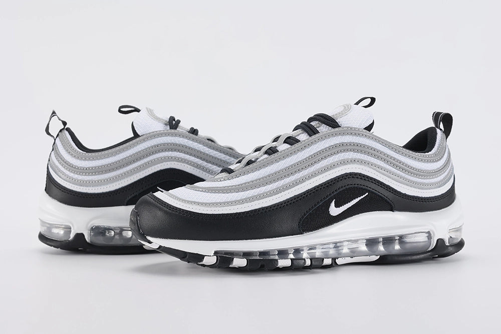 Air Max 97 Black Metallic Silver - Full Outsole View on White Background Showing Two-Tone Outsole White Rubber Square-Block Grid Traction at Forefoot Black Rubber at Heel and White Swoosh Logo on Heel Outsole