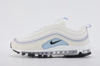 Air Max 97 Ghost - Toe Box Close Up on White Background Showing Sail Perforated Leather with Dense Small-Circle Perforation Pattern White Fine Mesh Quarter Panel Ghost Blue Wave Stripe Bands and Black Mini Swoosh Logo on Lateral Toe Box