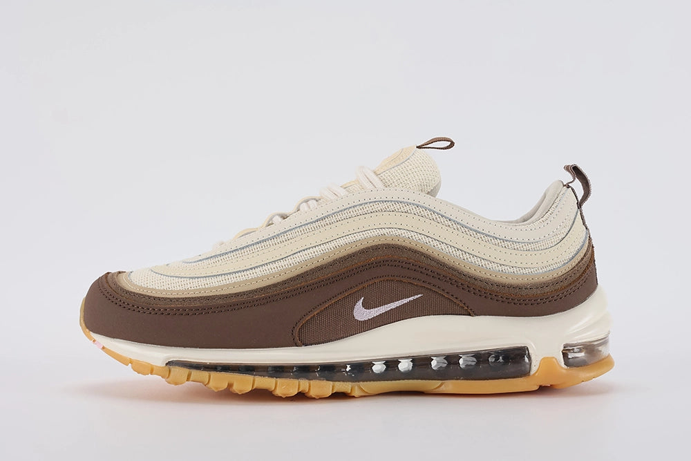 Air Max 97 Muslin Pink Foam - Toe Box Close Up on White Background Showing Dark Baroque Brown Smooth Leather with Contrast Stitching Muslin Coarse Burlap-Weave Mesh Quarter Panel Three-Tone Brown Wave Stripes and White Midsole with Gum Outsole