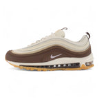 Air Max 97 Muslin Pink Foam - Full Lateral Profile View on White Background Showing Dark Baroque Brown Leather Toe Box Muslin Burlap-Weave Mesh Quarter Panel Three-Tone Graduated Brown Wave Stripe Bands and White Midsole with Pink Foam Accent Line and Gum Outsole