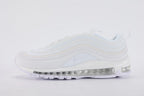 Air Max 97 Triple White - Lateral Midfoot Close Up on White Background Showing White Iridescent Mesh Quarter Panel with Subtle Iridescent Blue-Purple Light Shift Three Tonal White Wave Stripe Bands and White Midsole with Clear Heel Air Unit