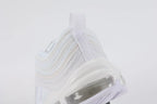Air Max 97 Triple White - Tongue and Ankle Collar Close Up on White Background Showing White Tongue Circular White Perforated Leather Badge with White Swoosh Embroidery Ice Blue Textile Ankle Collar Lining and White Flat Laces