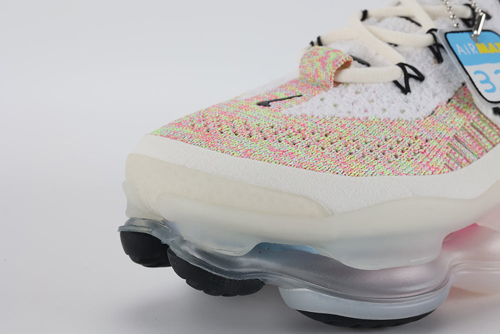 Air Max Scorpion Air Max Day - Tongue and Lace Area Top Down View on White Background Showing White Terry Cloth Tongue with Teal Interior Lining Black Mini Swoosh Embroidery Black X-Form Lace Locks and White Flyknit Toe Box with Multicolour Rainbow Quarter Panel