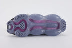 Air Max Scorpion Flyknit Black Persian Violet - Heel Counter Close Up on White Background Showing Black Wide Rubber Heel Pull Tab with Royal Blue Dot-Grid Texture Black Loop-Pile Flyknit High Ankle Collar and Persian Violet AM Scorpion Air Unit at Heel with Fuchsia Chambers Visible