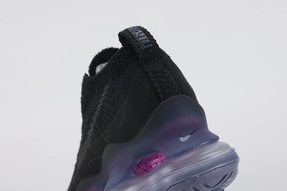 Air Max Scorpion Flyknit Black Persian Violet - Lace Area Close Up on White Background Showing Black Star-Form Plastic Lace Locks Royal Blue Dot-Grid Tongue Badge Black Coarse Loop-Pile Flyknit Quarter Panel and Slate Blue AM Scorpion Air Unit at Lateral Midfoot