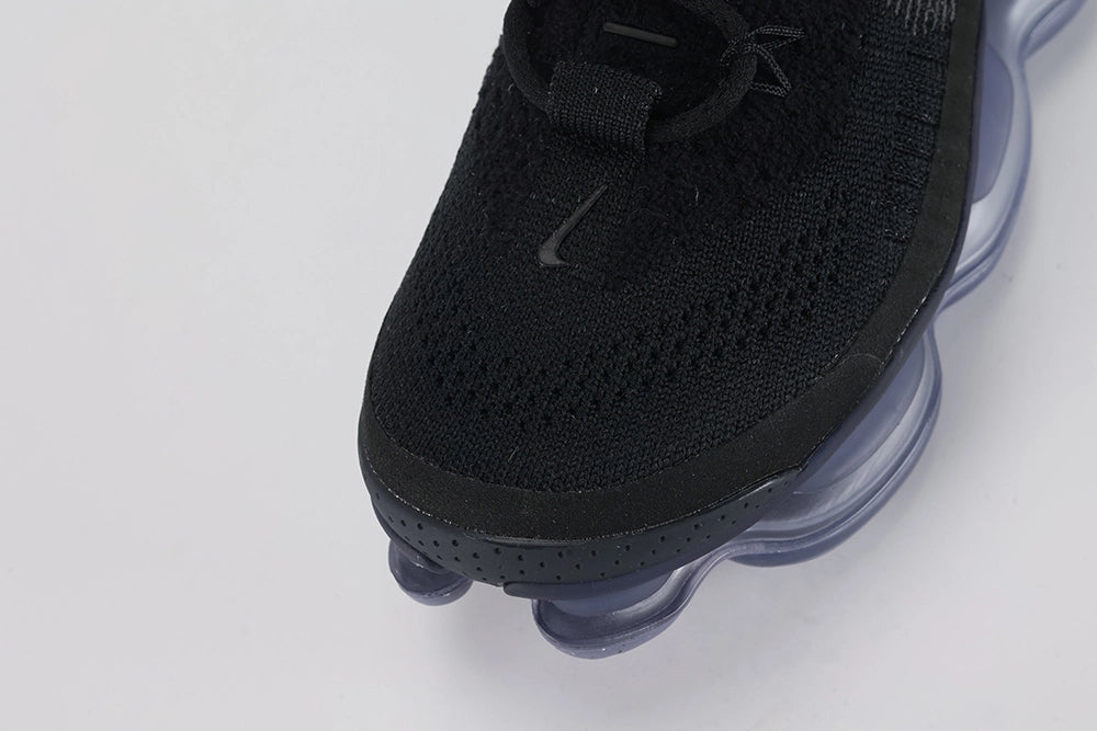 Air Max Scorpion Flyknit Black Persian Violet - Rear View of Both Shoes on White Background Showing Black Wide Rubber Heel Pull Tabs with Royal Blue Dot-Grid Texture Black High Ankle Collar Persian Violet Mini Swoosh on Lateral Heel Midsole and Persian Violet to Slate Blue Gradient AM Scorpion Air Unit with Fuchsia Chambers