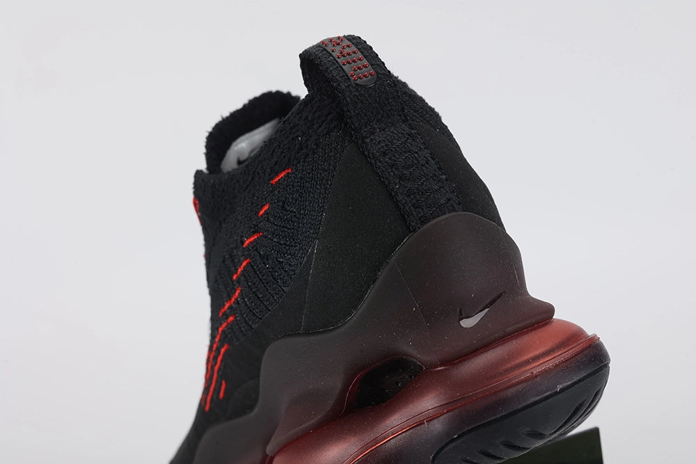 Air Max Scorpion Flyknit Bred Black University Red - Rear View of Both Shoes on White Background Showing Black Wide Rubber Heel Pull Tabs with Crimson Dot-Grid Texture Black High Ankle Collar and Deep Burgundy AM Scorpion Air Unit at Heel