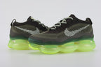 Air Max Scorpion Flyknit Cargo Khaki Volt - Full Outsole View on White Background Showing Full-Coverage Volt Neon Yellow Semi-Transparent AM Scorpion Air Base with Black Speckle Dots Volt Chevron Traction Pods at Forefoot and Heel Corners and Semi-Transparent Ice Green Central Air Chamber Base Zone