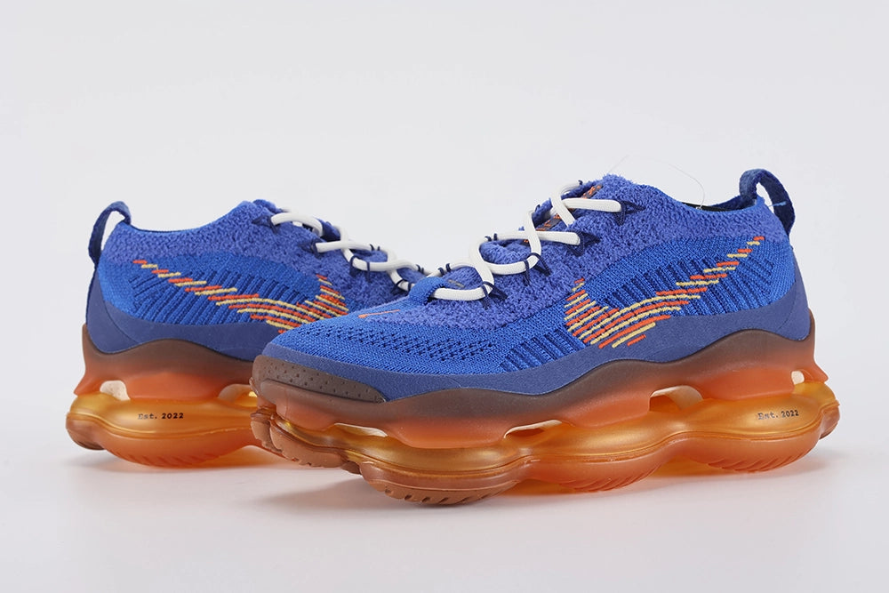 Air Max Scorpion Flyknit Frank Rudy Game Royal Total Orange - Full Outsole View on White Background Showing Total Orange to Amber Gradient Semi-Transparent AM Scorpion Air Base Dark Brown Chevron Rubber Traction Pods at Forefoot and Heel Corners and Amber Honey Central Air Chamber Base with Chevron Traction Texture