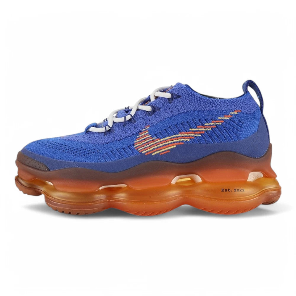 Air Max Scorpion Flyknit Frank Rudy Game Royal Total Orange - Full Lateral Profile View on White Background Showing Game Royal Coarse Loop-Pile Flyknit AM Scorpion Upper Total Orange Mini Swoosh on Toe Box Multicolour Vertical Rainbow Stripe Embroidery on Lateral Heel Panel White Rope Lace and Total Orange to Amber Gradient AM Scorpion Air Unit