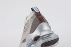 Air Max Scorpion Flyknit Gaiter Light Bone Metallic Silver - Toe Box Top Down View on Grey Background Showing Heathered Light Bone Warm Grey Speckle Flyknit Toe Box with Black Speckle Dots Light Bone Perforated Suede Overlay and Metallic Silver AM Scorpion Air Unit at Forefoot