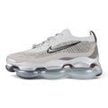 Air Max Scorpion Flyknit Gaiter Light Bone Metallic Silver - Full Lateral Profile View on Grey Background Showing Heathered Light Bone Warm Grey Speckle Flyknit Upper Light Bone Perforated Suede Overlay Black Filled Swoosh Embroidery Silver Metallic Rope Lace Powder Blue Lace Garage Smoky Mauve Terry Gaiter at Heel Collar and Large-Volume Metallic Silver AM Scorpion Air Unit