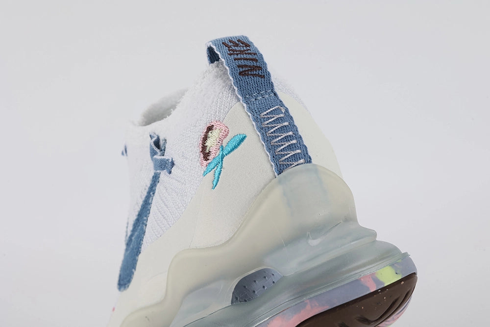 Air Max Scorpion Flyknit Just Do It White Diffused Blue - Full Lateral Three-Quarter View on White Background Showing Both Shoes White Terry Flyknit Upper Diffused Blue Terry Swoosh Hot Pink JUST DO IT Slogan Embroidery Diffused Blue Terry Laces and Frosted Grey AM Scorpion Air Unit with Multicolour Iridescent Outsole