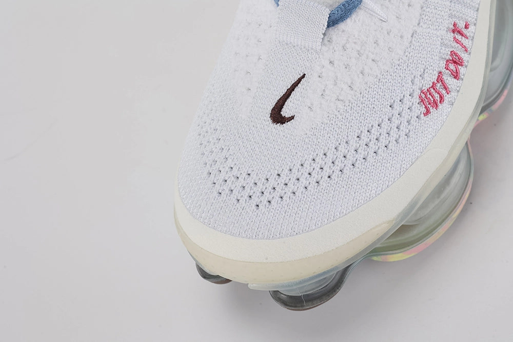 Air Max Scorpion Flyknit Just Do It White Diffused Blue - Product Shot with Box on White Background Showing Both Shoes White Terry Flyknit Upper Diffused Blue Terry Swoosh Hot Pink JUST DO IT Embroidery and Frosted Grey AM Scorpion Air Unit with Multicolour Iridescent Outsole
