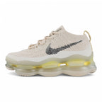 Air Max Scorpion Flyknit Lemon Wash Light Orewood Brown Lemon Chiffon - Full Lateral Profile View on White Background Showing Light Orewood Brown Boucle Flyknit AM Scorpion Upper with Silver Metallic Thread Black Sketch-Outline Swoosh on Lateral Midfoot Tonal Off-White Flat Laces Silver Oval Lace Keepers with Black Dot-Grid Texture Lemon Chiffon Heel Pull Tab and Frosted Ice AM Scorpion Air Unit with Lemon Chiffon Chambers