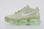 Air Max Scorpion Flyknit Olive Aura Light Bone Sea Glass Volt - Full Outsole View on Grey Background Showing Sea Glass Semi-Transparent AM Scorpion Air Base Volt Neon Yellow Central Air Chamber Bases Ice Green Central Air Bottom Zone and White Chevron Traction Pods at Forefoot and Heel