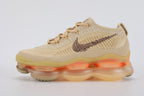 Air Max Scorpion Flyknit Sesame Dark Driftwood Total Orange - Toe Box Top Down View on White Background Showing Sesame Fine-Knit Flyknit Toe Box with Gold Metallic Thread Dark Driftwood Mini Swoosh Embroidery Tonal Sesame Rope Laces Sesame Lace Keeper with Dark Driftwood Dot-Grid Texture and Lemon Chiffon AM Scorpion Air Unit at Forefoot