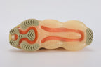 Air Max Scorpion Flyknit Sesame Dark Driftwood Total Orange - Heel Counter Rear View on White Background Showing Sesame Terry Loop-Pile Flyknit Heel Counter Dark Driftwood Sketch Swoosh Extending to Lateral Heel Sesame Wide Rubber Heel Pull Tabs with Dark Driftwood Dot-Grid Texture and Lemon Chiffon to Total Orange Gradient AM Scorpion Air Unit at Heel with Orange Chambers Visible