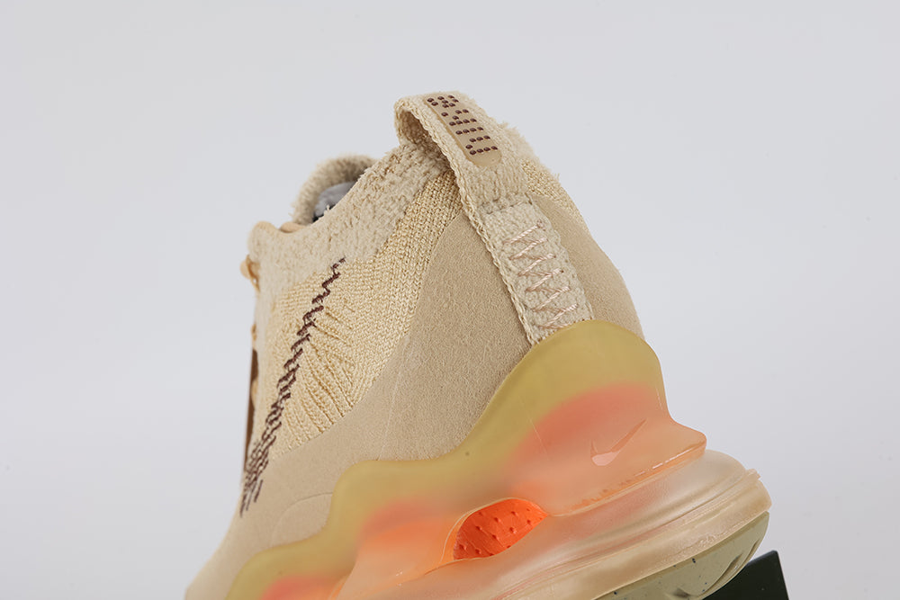 Air Max Scorpion Flyknit Sesame Dark Driftwood Total Orange - Toe Box Forefoot Close Up on White Background Showing Sesame Fine-Knit Flyknit with Gold Metallic Thread Dark Driftwood Mini Swoosh and Lemon Chiffon to Total Orange Gradient AM Scorpion Air Unit at Forefoot with Sage Traction Pods