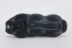 Air Max Scorpion Flyknit Triple Black Anthracite - Toe Box Top Down View on Grey Background Showing Black Fine-Knit Flyknit Toe Box Anthracite Mini Swoosh Black Rope Laces Black Rectangular Lace Keeper with Black Dot-Grid Texture and Black Iridescent Flyknit on Lateral Midfoot Upper Zone