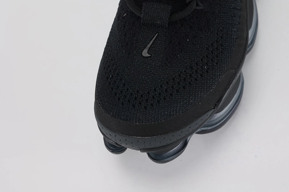 Air Max Scorpion Flyknit Triple Black Anthracite - Full Both Shoes Lateral Three-Quarter View on Grey Background Showing Four-Texture Black Flyknit Upper Black Iridescent Lateral Panel Black Perforated Suede Overlay Black Rope Laces and Black to Dark Smoke Grey AM Scorpion Air Unit