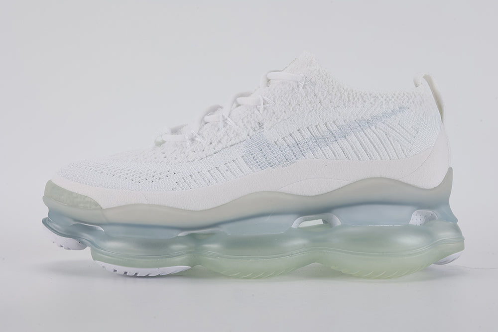 Air Max Scorpion Flyknit White Football Grey Ice Blue - Toe Box Close Up on Grey Background Showing White Fine-Knit Flyknit with Grey Speckle Dots White Tonal Mini Swoosh White Flat Laces and Frosted Ice AM Scorpion Air Unit at Forefoot with Ice Blue Chambers